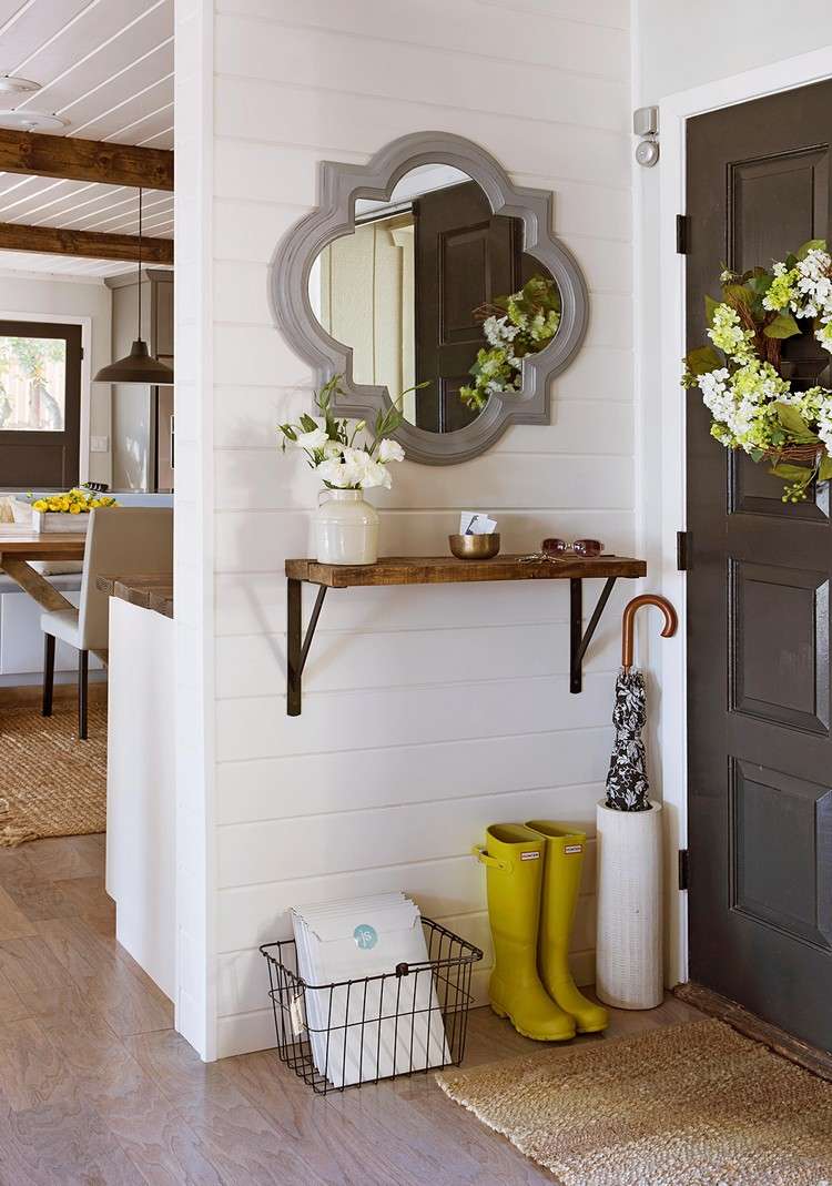 Design a small hallway with vintage mirrors