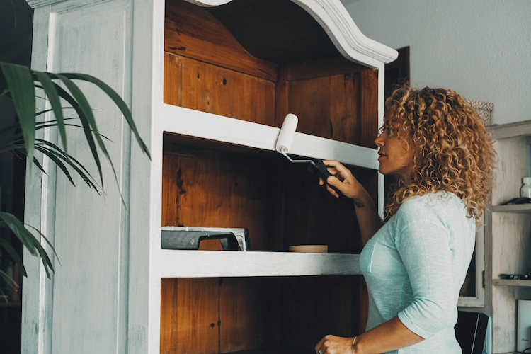 Spice up old cupboards with fresh white paint and use them as an accent in the living room