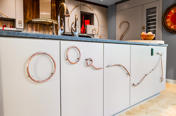 Install eye-catching door handles and spice up old cupboards cheaply