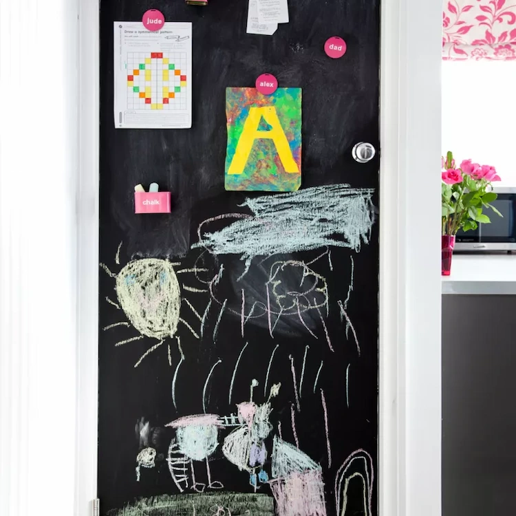 Replace cupboard doors with creative design ideas or equip with a drawing board for small children