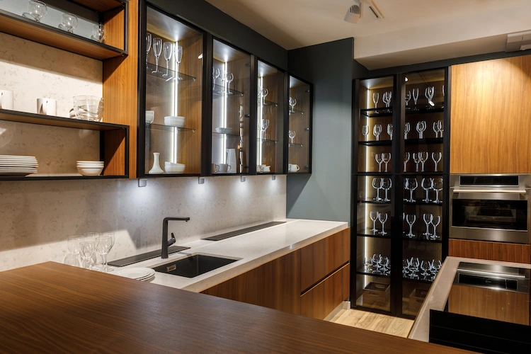 renovated kitchen with modern kitchen cabinets with glass doors