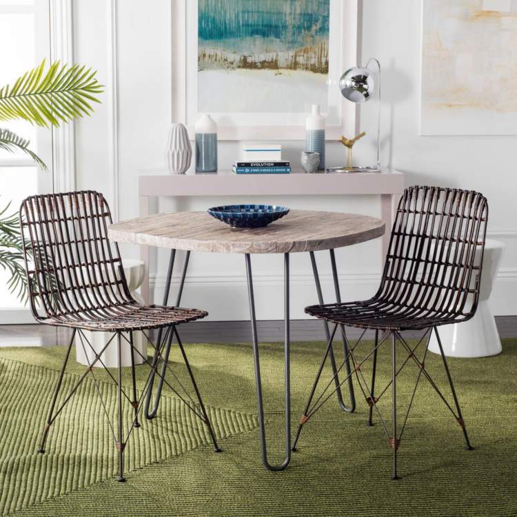Rattan chairs dining room dining table metal legs paintings vases