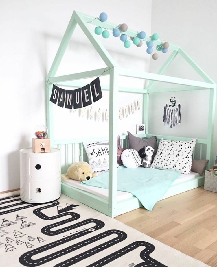 Montessori children's room sleeping area in mint green build bed close to the ground