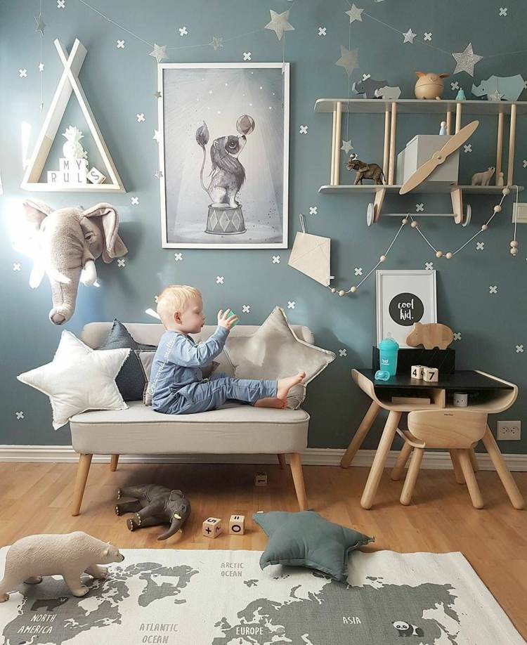 Montessori children's room with wallpaper in blue-green stars as decoration
