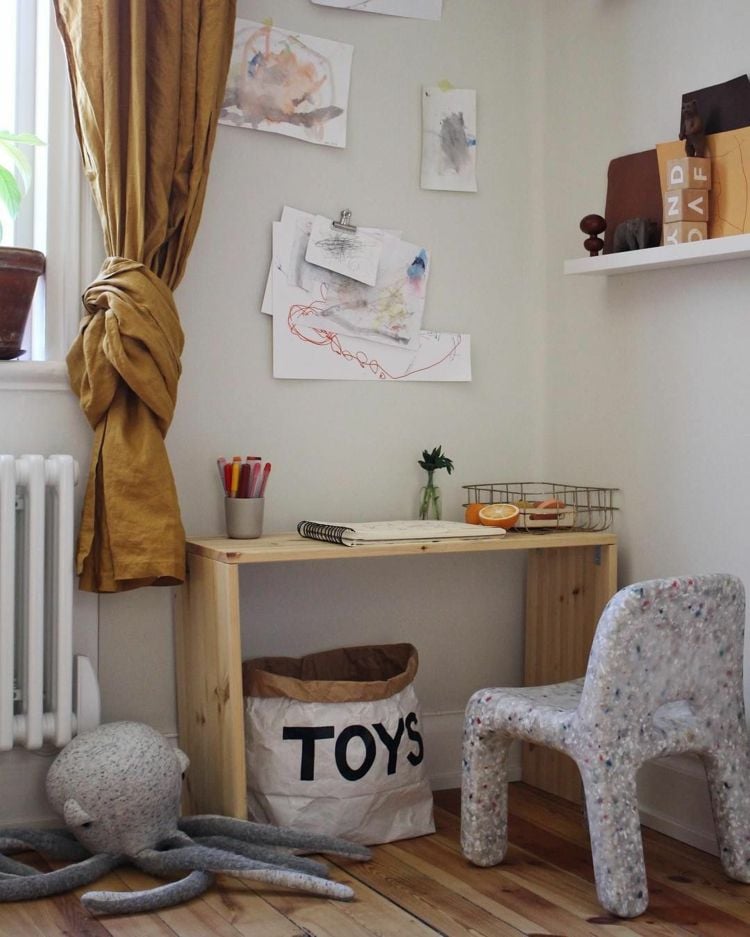 Play corner, painting corner with small wooden desk in mustard color