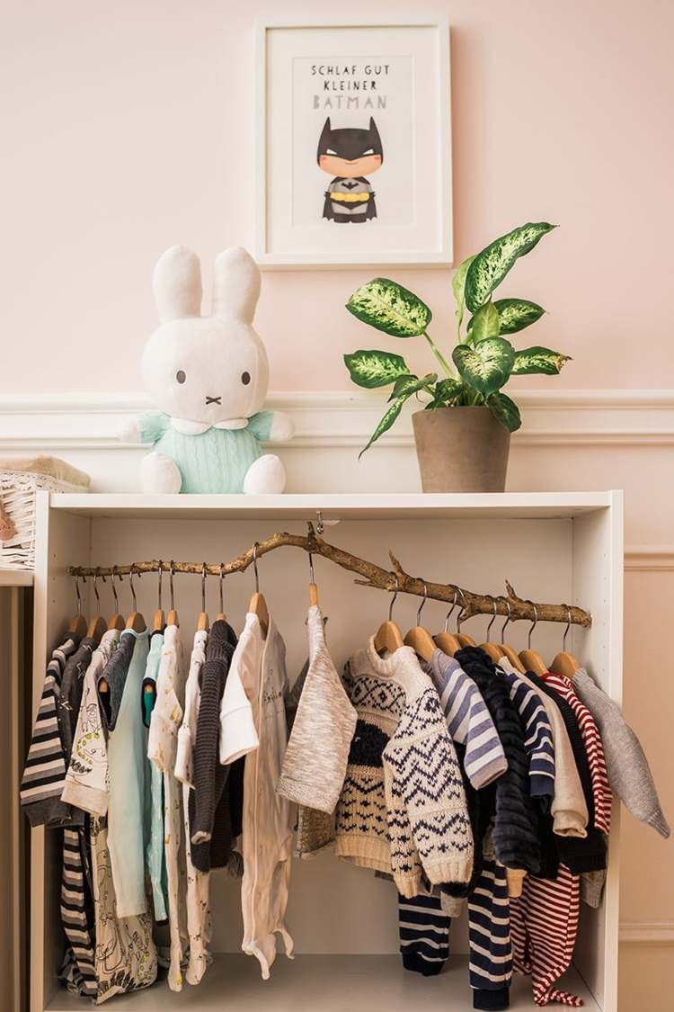 Alternative to the wardrobe in the children's room, open cupboard with clothes rail branch